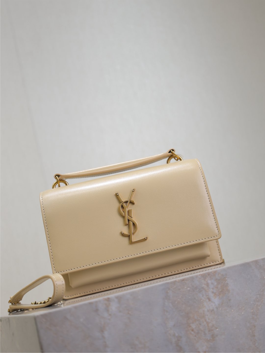 Saint Laurent Sunset gold bag – front view